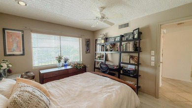 Beautifully renovated and FULLY FURNISHED offered turn-key, this on Fountains Golf and Country Club in Florida - for sale on GolfHomes.com, golf home, golf lot