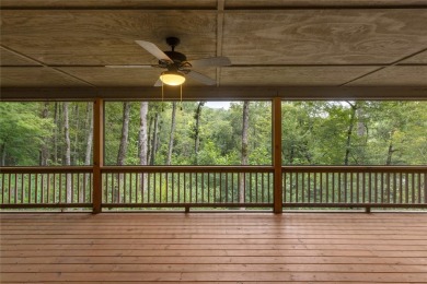 Enjoy an inviting three-bedroom, two-bathroom Arts and Crafts on Sapphire National Golf Club in North Carolina - for sale on GolfHomes.com, golf home, golf lot
