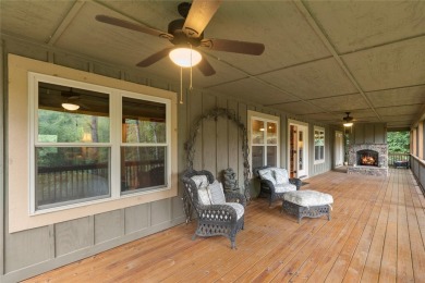 Enjoy an inviting three-bedroom, two-bathroom Arts and Crafts on Sapphire National Golf Club in North Carolina - for sale on GolfHomes.com, golf home, golf lot