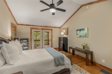 Enjoy an inviting three-bedroom, two-bathroom Arts and Crafts on Sapphire National Golf Club in North Carolina - for sale on GolfHomes.com, golf home, golf lot