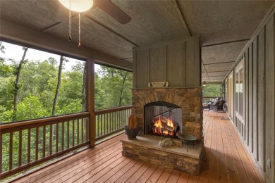 Enjoy an inviting three-bedroom, two-bathroom Arts and Crafts on Sapphire National Golf Club in North Carolina - for sale on GolfHomes.com, golf home, golf lot