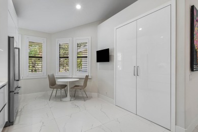 This stylishly renovated penthouse condo blends modern finishes on Polo Club of Boca Raton in Florida - for sale on GolfHomes.com, golf home, golf lot