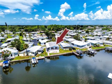 Experience the best of Florida living in this beautifully on Mangrove Bay Golf Course in Florida - for sale on GolfHomes.com, golf home, golf lot