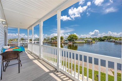 Experience the best of Florida living in this beautifully on Mangrove Bay Golf Course in Florida - for sale on GolfHomes.com, golf home, golf lot