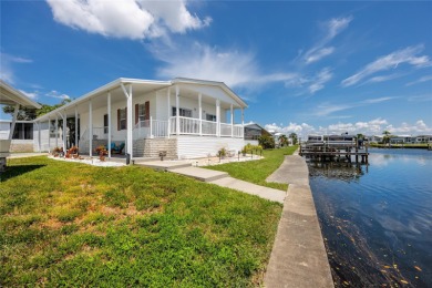 Experience the best of Florida living in this beautifully on Mangrove Bay Golf Course in Florida - for sale on GolfHomes.com, golf home, golf lot
