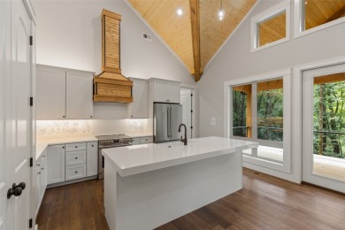 Discover the epitome of modern mountain living with this brand on Sapphire National Golf Club in North Carolina - for sale on GolfHomes.com, golf home, golf lot