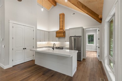 Discover the epitome of modern mountain living with this brand on Sapphire National Golf Club in North Carolina - for sale on GolfHomes.com, golf home, golf lot