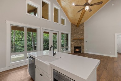 Discover the epitome of modern mountain living with this brand on Sapphire National Golf Club in North Carolina - for sale on GolfHomes.com, golf home, golf lot