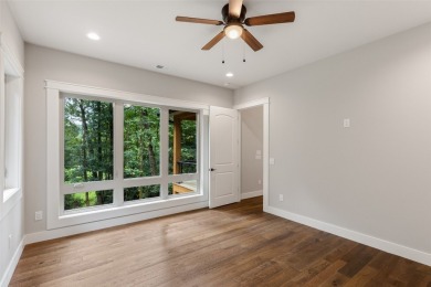 Discover the epitome of modern mountain living with this brand on Sapphire National Golf Club in North Carolina - for sale on GolfHomes.com, golf home, golf lot