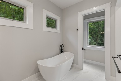 Discover the epitome of modern mountain living with this brand on Sapphire National Golf Club in North Carolina - for sale on GolfHomes.com, golf home, golf lot