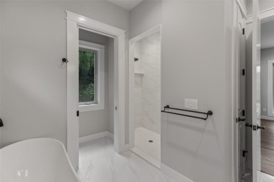 Discover the epitome of modern mountain living with this brand on Sapphire National Golf Club in North Carolina - for sale on GolfHomes.com, golf home, golf lot