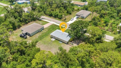 NO HOA - FENCED YARD - MINUTES TO CHARLOTTE HARBOR! This on Port Charlotte Golf Club in Florida - for sale on GolfHomes.com, golf home, golf lot