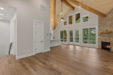 Discover the epitome of modern mountain living with this brand on Sapphire National Golf Club in North Carolina - for sale on GolfHomes.com, golf home, golf lot