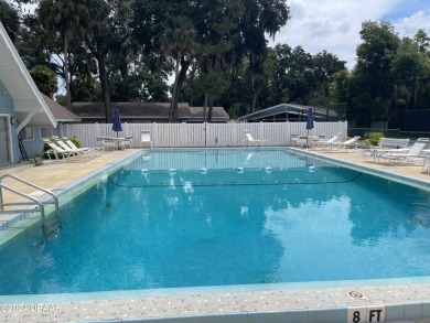 Welcome Home to this quiet and comfortable half duplex in the on New Smyrna Beach Golf Course in Florida - for sale on GolfHomes.com, golf home, golf lot