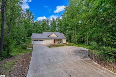 Tucked beside a quiet creek and backing up to The Rock Golf Club on The Rock At Jocassee in South Carolina - for sale on GolfHomes.com, golf home, golf lot