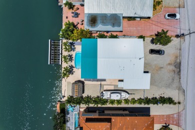 Embrace the laid back charm of the Florida Keys with this on Key Colony Beach Golf Course in Florida - for sale on GolfHomes.com, golf home, golf lot