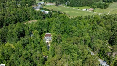 Tucked beside a quiet creek and backing up to The Rock Golf Club on The Rock At Jocassee in South Carolina - for sale on GolfHomes.com, golf home, golf lot