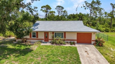 NO HOA - FENCED YARD - MINUTES TO CHARLOTTE HARBOR! This on Port Charlotte Golf Club in Florida - for sale on GolfHomes.com, golf home, golf lot