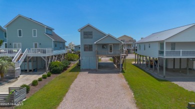Perched on pilings and perfectly positioned to capture sweeping on Founders Club At St. James Plantation in North Carolina - for sale on GolfHomes.com, golf home, golf lot