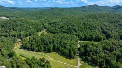 Tucked beside a quiet creek and backing up to The Rock Golf Club on The Rock At Jocassee in South Carolina - for sale on GolfHomes.com, golf home, golf lot