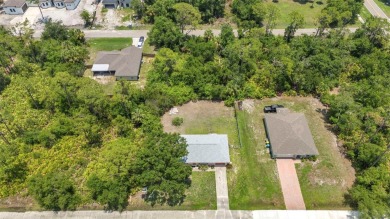 NO HOA - FENCED YARD - MINUTES TO CHARLOTTE HARBOR! This on Port Charlotte Golf Club in Florida - for sale on GolfHomes.com, golf home, golf lot