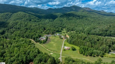 Tucked beside a quiet creek and backing up to The Rock Golf Club on The Rock At Jocassee in South Carolina - for sale on GolfHomes.com, golf home, golf lot