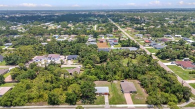 NO HOA - FENCED YARD - MINUTES TO CHARLOTTE HARBOR! This on Port Charlotte Golf Club in Florida - for sale on GolfHomes.com, golf home, golf lot