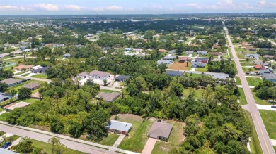 NO HOA - FENCED YARD - MINUTES TO CHARLOTTE HARBOR! This on Port Charlotte Golf Club in Florida - for sale on GolfHomes.com, golf home, golf lot