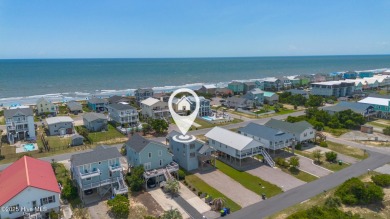 Perched on pilings and perfectly positioned to capture sweeping on Founders Club At St. James Plantation in North Carolina - for sale on GolfHomes.com, golf home, golf lot