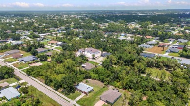 NO HOA - FENCED YARD - MINUTES TO CHARLOTTE HARBOR! This on Port Charlotte Golf Club in Florida - for sale on GolfHomes.com, golf home, golf lot