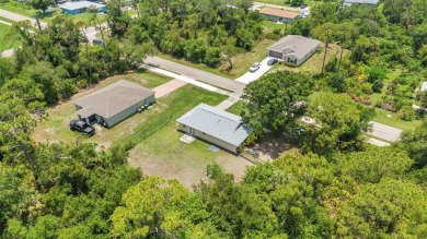 NO HOA - FENCED YARD - MINUTES TO CHARLOTTE HARBOR! This on Port Charlotte Golf Club in Florida - for sale on GolfHomes.com, golf home, golf lot