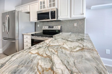 Live in luxury!  Amenity rich condo living with scenic views of on Barefoot Resort and Golf Club  in South Carolina - for sale on GolfHomes.com, golf home, golf lot