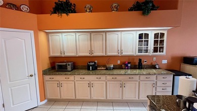 Welcome to 34 Woodfield Drive, a beautifully maintained on The Grand Club - Pine Lakes Course in Florida - for sale on GolfHomes.com, golf home, golf lot