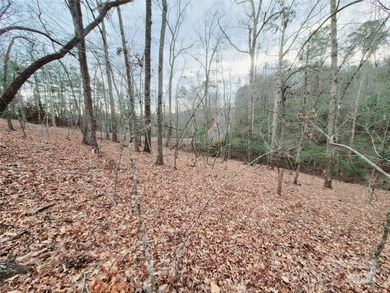 Tucked inside the gated community of Riverbend at Lake Lure on Lake Lure Municipal Golf Course in North Carolina - for sale on GolfHomes.com, golf home, golf lot