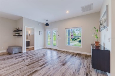 Experience the Best of Country Elegance and Modern Living in on Seminole Lakes Country Club in Florida - for sale on GolfHomes.com, golf home, golf lot