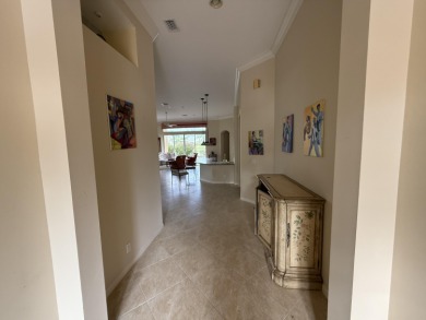 This 3-bedroom plus den, 3.5-bath home is located in the on Wycliffe Golf and Country Club in Florida - for sale on GolfHomes.com, golf home, golf lot