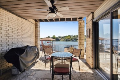 Check out this low-maintenance, waterfront townhome in the on De Cordova Bend Country Club in Texas - for sale on GolfHomes.com, golf home, golf lot