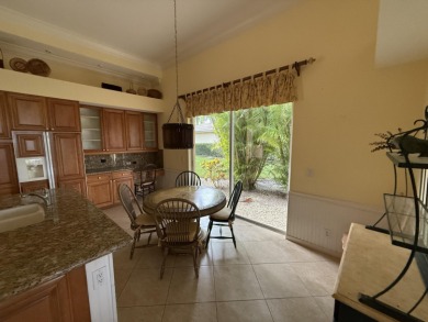 This 3-bedroom plus den, 3.5-bath home is located in the on Wycliffe Golf and Country Club in Florida - for sale on GolfHomes.com, golf home, golf lot