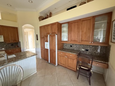 This 3-bedroom plus den, 3.5-bath home is located in the on Wycliffe Golf and Country Club in Florida - for sale on GolfHomes.com, golf home, golf lot