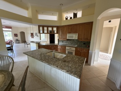 This 3-bedroom plus den, 3.5-bath home is located in the on Wycliffe Golf and Country Club in Florida - for sale on GolfHomes.com, golf home, golf lot