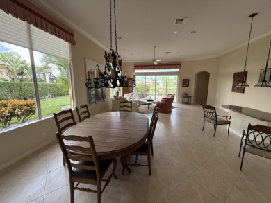 This 3-bedroom plus den, 3.5-bath home is located in the on Wycliffe Golf and Country Club in Florida - for sale on GolfHomes.com, golf home, golf lot