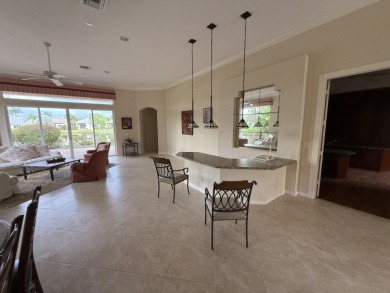 This 3-bedroom plus den, 3.5-bath home is located in the on Wycliffe Golf and Country Club in Florida - for sale on GolfHomes.com, golf home, golf lot