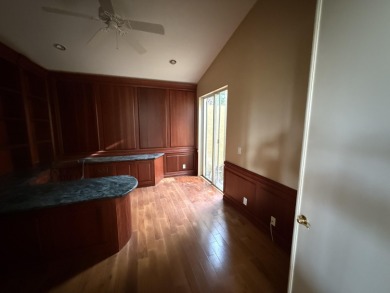 This 3-bedroom plus den, 3.5-bath home is located in the on Wycliffe Golf and Country Club in Florida - for sale on GolfHomes.com, golf home, golf lot