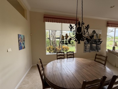 This 3-bedroom plus den, 3.5-bath home is located in the on Wycliffe Golf and Country Club in Florida - for sale on GolfHomes.com, golf home, golf lot