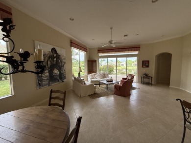 This 3-bedroom plus den, 3.5-bath home is located in the on Wycliffe Golf and Country Club in Florida - for sale on GolfHomes.com, golf home, golf lot