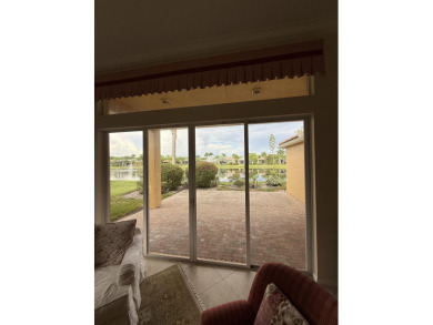 This 3-bedroom plus den, 3.5-bath home is located in the on Wycliffe Golf and Country Club in Florida - for sale on GolfHomes.com, golf home, golf lot