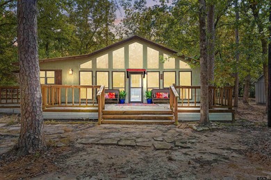 Welcome home to a warm and inviting retreat tucked away among on Holly Lake Ranch Golf Club in Texas - for sale on GolfHomes.com, golf home, golf lot