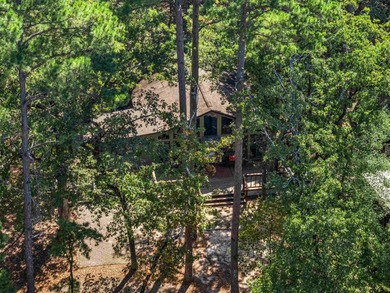Welcome home to a warm and inviting retreat tucked away among on Holly Lake Ranch Golf Club in Texas - for sale on GolfHomes.com, golf home, golf lot