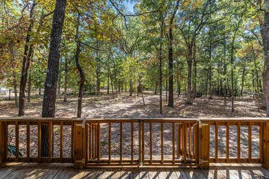 Welcome home to a warm and inviting retreat tucked away among on Holly Lake Ranch Golf Club in Texas - for sale on GolfHomes.com, golf home, golf lot