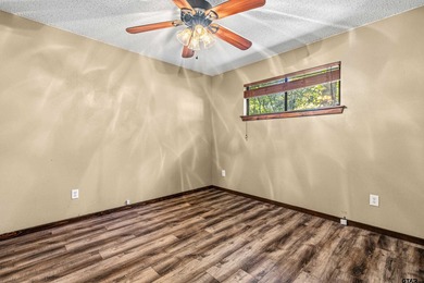 Welcome home to a warm and inviting retreat tucked away among on Holly Lake Ranch Golf Club in Texas - for sale on GolfHomes.com, golf home, golf lot